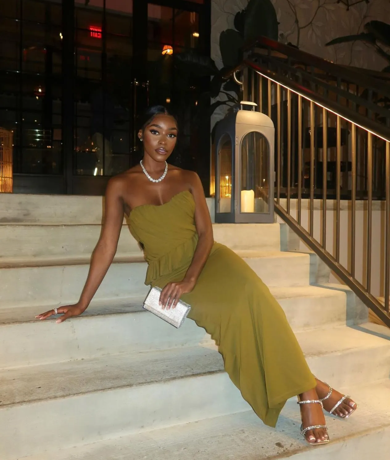 NBD olive gown on stone steps